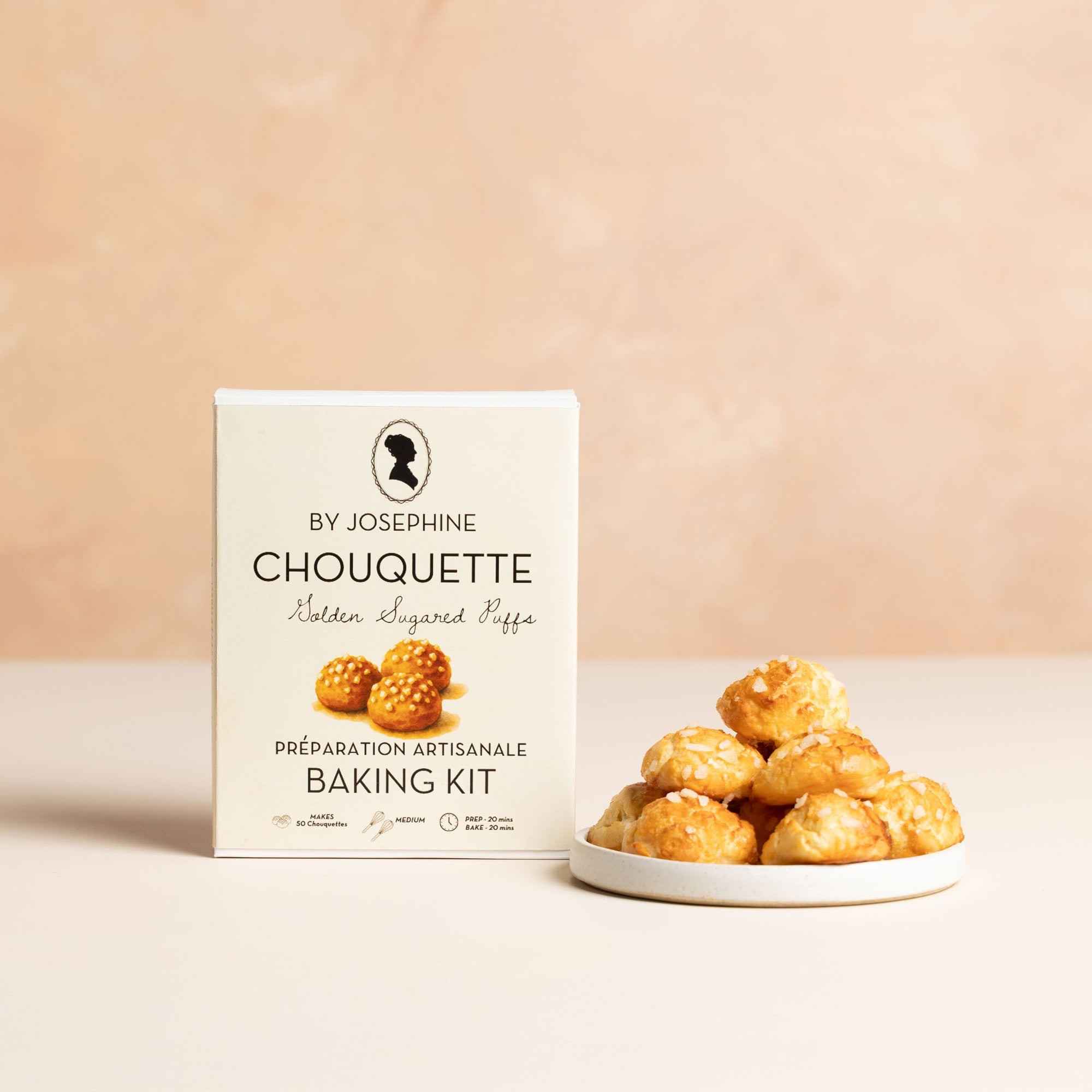Chouquette baking kit with a plate of chouquettes on a beige background