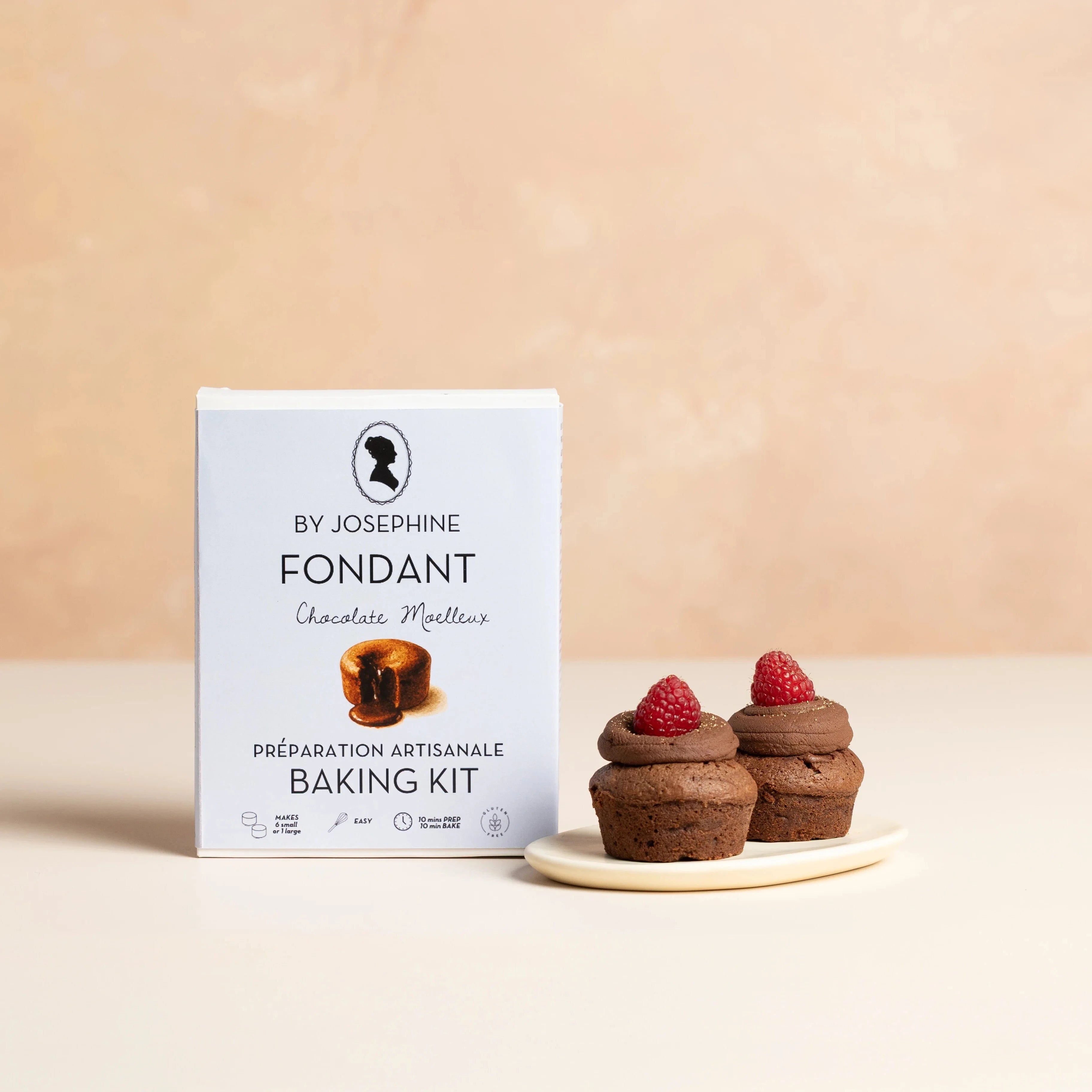 Fondant baking kit packaging with two chocolate mousse cakes on a beige background