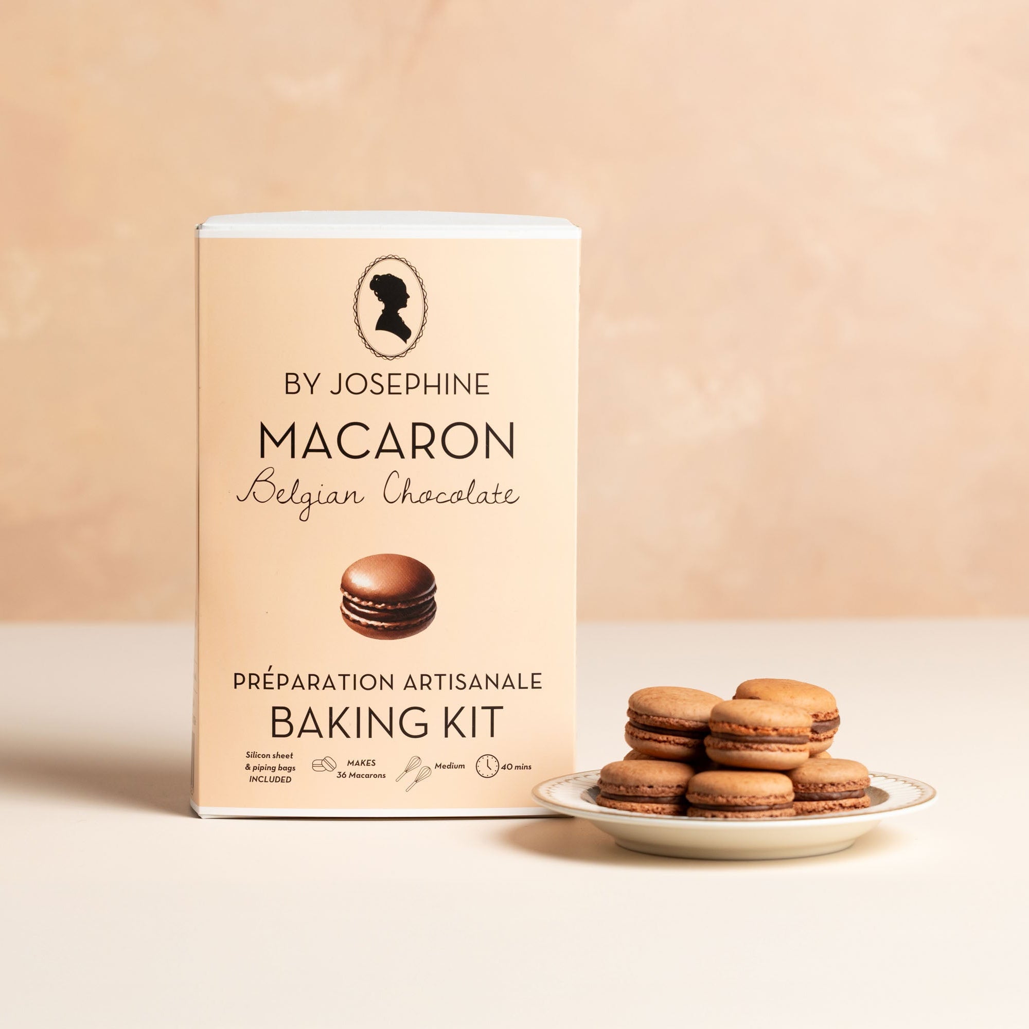 Macaron baking kit with chocolate macarons on a beige background